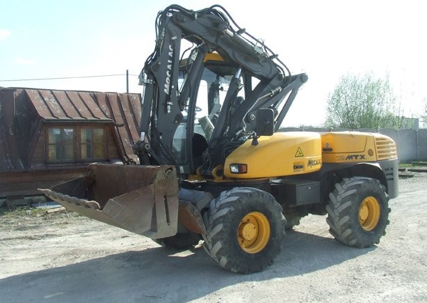 Koparka kołowa Mecalac 12 MTX z roku 2009 — zdjęcie 1